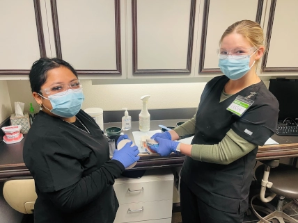 dental assistant students posing for a photo from their dental assistant school
